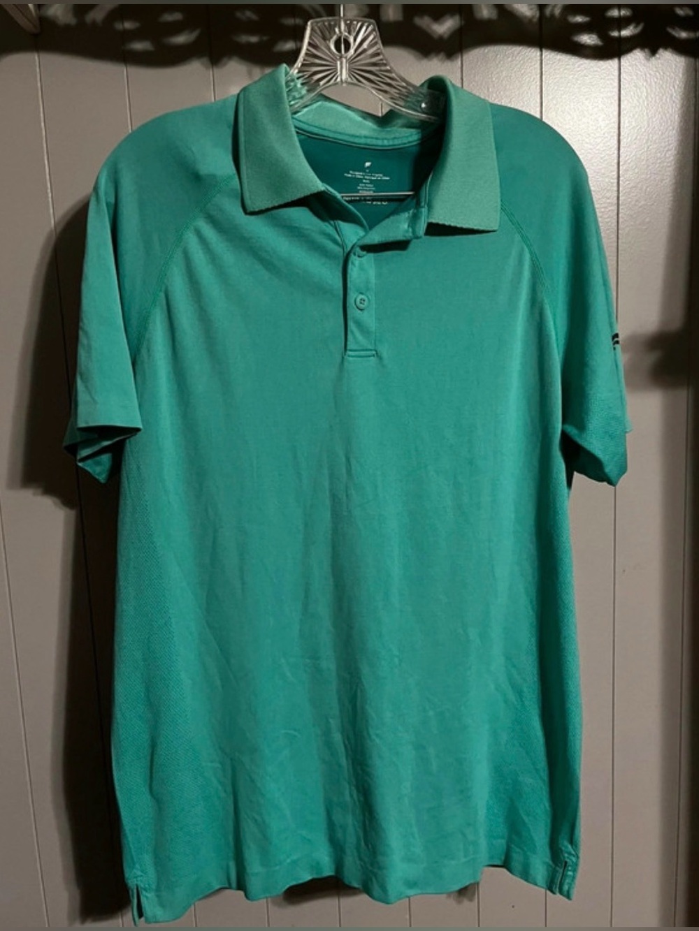 Fabletics Training Day Polo in teal green featuring sweat-wicking stretch fabric